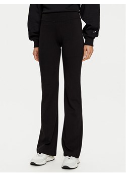 Champion Legginsy 117559 Czarny Flare Fit ze sklepu MODIVO w kategorii Spodnie damskie - zdjęcie 182752584