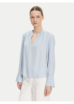 Tommy Hilfiger Bluzka WW0WW44049 Błękitny Regular Fit ze sklepu MODIVO w kategorii Bluzki damskie - zdjęcie 182754014