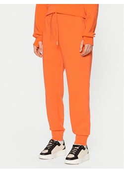 Lacoste Spodnie dresowe XF0343 Pomarańczowy Regular Fit ze sklepu MODIVO w kategorii Spodnie damskie - zdjęcie 182754264