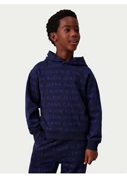 Calvin Klein Jeans Bluza Ckj Aop Hoodie IB0IB02322 Granatowy Regular Fit ze sklepu MODIVO w kategorii Bluzy chłopięce - zdjęcie 182755300