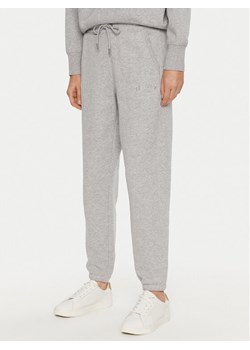 DKNY Sport Spodnie dresowe DP4P3471 Szary Regular Fit ze sklepu MODIVO w kategorii Spodnie damskie - zdjęcie 182756403