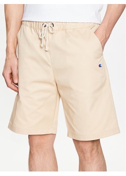 Champion Szorty materiałowe 217239 Beżowy Relaxed Fit ze sklepu MODIVO w kategorii Spodenki męskie - zdjęcie 182761331