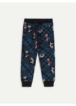 Coccodrillo Spodnie dresowe ZC4120101ABK Granatowy Slim Fit ze sklepu MODIVO w kategorii Spodnie chłopięce - zdjęcie 182762363