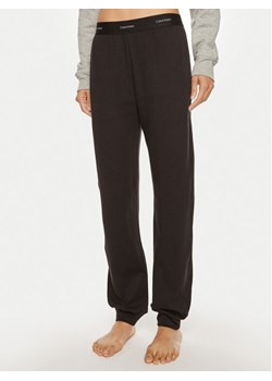 Calvin Klein Underwear Spodnie dresowe 000QS7271E Czarny Regular Fit ze sklepu MODIVO w kategorii Spodnie damskie - zdjęcie 182763513
