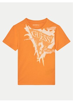 Guess T-Shirt L5GI20 K8HM4 Pomarańczowy Regular Fit ze sklepu MODIVO w kategorii T-shirty chłopięce - zdjęcie 182765022