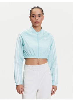 adidas Bluza adicolor Teamgeist JD0267 Turkusowy Slim Fit ze sklepu MODIVO w kategorii Bluzy damskie - zdjęcie 183620253