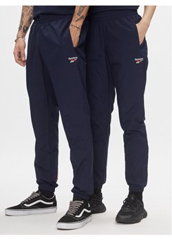 Reebok Spodnie dresowe Classics Vector Tracksuit Bottoms H54439 Niebieski Slim Fit ze sklepu MODIVO w kategorii Spodnie męskie - zdjęcie 183620363