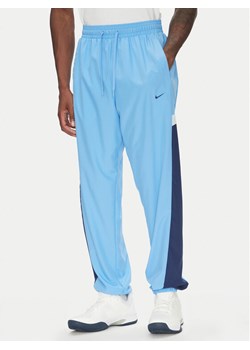 Nike Spodnie dresowe Icon FZ0250 Niebieski Relaxed Fit ze sklepu MODIVO w kategorii Spodnie męskie - zdjęcie 183652972