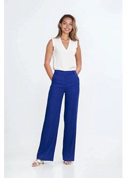 Spodnie bootcut z kieszeniami - indygo ze sklepu Cudmoda w kategorii Spodnie damskie - zdjęcie 183696380