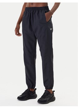 Reebok Spodnie dresowe Vector 100221435 Czarny Relaxed Fit ze sklepu MODIVO w kategorii Spodnie damskie - zdjęcie 183701334