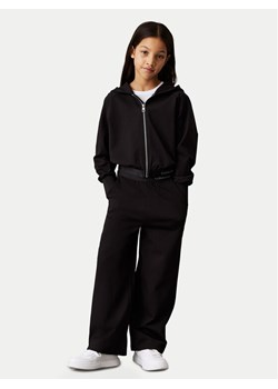 Calvin Klein Jeans Dres Logo Tape IG0IG02817 M Czarny Regular Fit ze sklepu MODIVO w kategorii Dresy chłopięce - zdjęcie 183706314