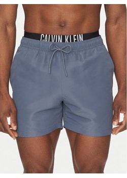 Calvin Klein Swimwear Szorty kąpielowe KM0KM01093 Szary Regular Fit ze sklepu MODIVO w kategorii Kąpielówki - zdjęcie 183737162