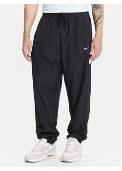 Nike Spodnie dresowe Icon FZ0250 Czarny Regular Fit ze sklepu MODIVO w kategorii Spodnie męskie - zdjęcie 183751622