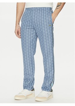 Lacoste Spodnie dresowe XH1440 Niebieski Regular Fit ze sklepu MODIVO w kategorii Spodnie męskie - zdjęcie 183813311