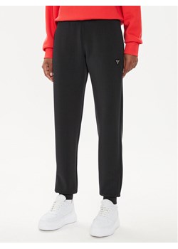 Guess Spodnie dresowe V4YB08 KCAY2 Czarny Regular Fit ze sklepu MODIVO w kategorii Spodnie damskie - zdjęcie 183874752