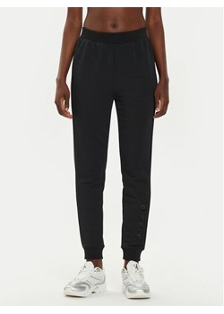 Calvin Klein Performance Spodnie dresowe 00GWF4P601 Czarny Regular Fit ze sklepu MODIVO w kategorii Spodnie damskie - zdjęcie 183944781