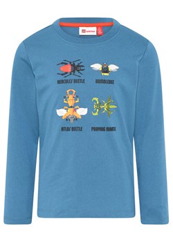 LEGO Bluzka 11010574 Niebieski Regular Fit ze sklepu MODIVO w kategorii T-shirty chłopięce - zdjęcie 183946194