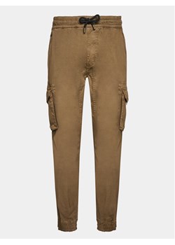Alpha Industries Joggery Twill 116202 Beżowy Regular Fit ze sklepu MODIVO w kategorii Spodnie męskie - zdjęcie 183947912