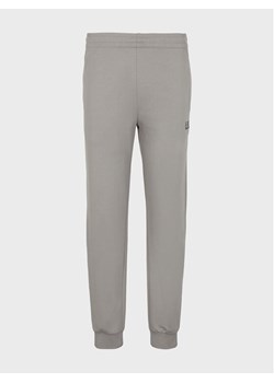 EA7 Emporio Armani Spodnie dresowe 8NPP53 PJ05Z 1920 Szary Regular Fit ze sklepu MODIVO w kategorii Spodnie męskie - zdjęcie 183948391