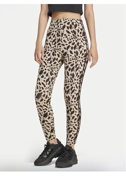 adidas Legginsy Essentials 3-Stripes Animal Print IX3722 Brązowy Slim Fit ze sklepu MODIVO w kategorii Spodnie damskie - zdjęcie 183948522