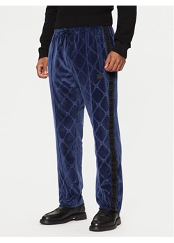 HUGO Spodnie dresowe Dislaco 50522512 Granatowy Relaxed Fit ze sklepu MODIVO w kategorii Spodnie męskie - zdjęcie 183948860