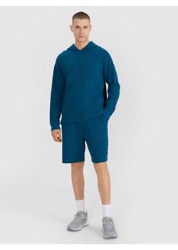 Męskie spodenki dresowe 4F 4FWSS25TSHOM536 - turkusowe ze sklepu Sportstylestory.com w kategorii Spodenki męskie - zdjęcie 184005373