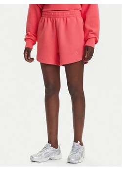 adidas Szorty sportowe ALL SZN Soft Lux KD9767 Koralowy Loose Fit ze sklepu MODIVO w kategorii Szorty - zdjęcie 184019282