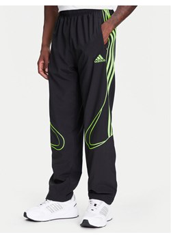 adidas Spodnie dresowe Teamgeist adicolor JW5869 Czarny Loose Fit ze sklepu MODIVO w kategorii Spodnie męskie - zdjęcie 184019452
