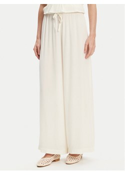 United Colors Of Benetton Spodnie materiałowe 4VW95F00C Écru Relaxed Fit ze sklepu MODIVO w kategorii Spodnie damskie - zdjęcie 184058051