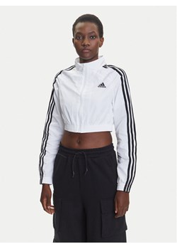 adidas Bluza Teamgeist adicolor JZ8275 Biały Slim Fit ze sklepu MODIVO w kategorii Bluzy damskie - zdjęcie 184058140