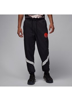 Męskie spodnie z tkaniny Paris Saint-Germain - Czerń ze sklepu Nike poland w kategorii Spodnie męskie - zdjęcie 184258314