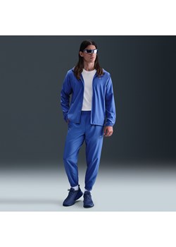 Męskie uniwersalne spodnie ze zwężanymi nogawkami Dri-FIT Nike Form - Niebieski ze sklepu Nike poland w kategorii Spodnie męskie - zdjęcie 184264842