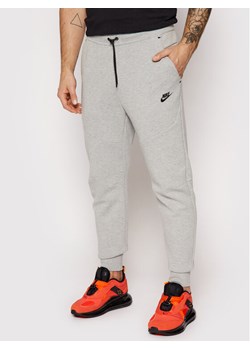 Nike Spodnie dresowe Nsw Tech Fleece CU4495 Szary Slim Fit ze sklepu MODIVO w kategorii Spodnie męskie - zdjęcie 184290554