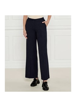 Calvin Klein Spodnie | flare fit | z dodatkiem wełny - id: CK245W000154146 - marki Calvin Klein - 184511444 Calvin Klein Spodnie | flare fit | z dodatkiem wełny ze sklepu Gomez Fashion Store w kategorii Spodnie damskie - zdjęcie 184511444