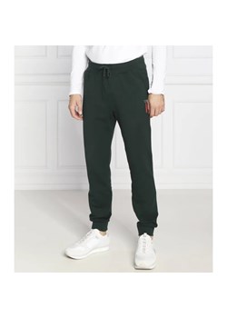 GUESS Spodnie dresowe Adam | Regular Fit ze sklepu Gomez Fashion Store w kategorii Spodnie męskie - zdjęcie 184512840