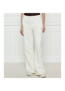 GUESS ACTIVE Spodnie dresowe ROBERTA | flare fit ze sklepu Gomez Fashion Store w kategorii Spodnie damskie - zdjęcie 184514561
