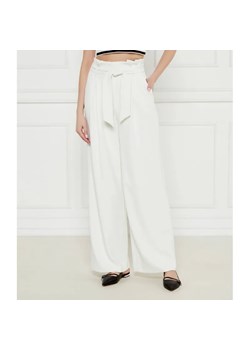 Marc Cain Spodnie z paskiem WICHITA | flare fit ze sklepu Gomez Fashion Store w kategorii Spodnie damskie - zdjęcie 184522392