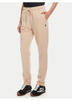 U.S. Polo Assn. Spodnie dresowe WUP1513 Beżowy Regular Fit ze sklepu MODIVO w kategorii Spodnie damskie - zdjęcie 184547061
