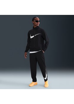 Męskie uniwersalne spodnie z luźnymi nogawkami Dri-FIT Nike Form - Czerń ze sklepu Nike poland w kategorii Spodnie męskie - zdjęcie 184551170