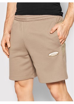 adidas Szorty sportowe R.Y.V. Basic Essential HC9460 Beżowy Regular Fit ze sklepu MODIVO w kategorii Spodenki męskie - zdjęcie 184560680