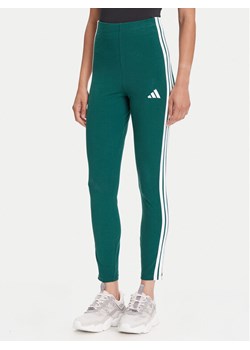 adidas Legginsy Essentials 3-Stripes KB7663 Zielony Slim Fit ze sklepu MODIVO w kategorii Spodnie damskie - zdjęcie 184562294