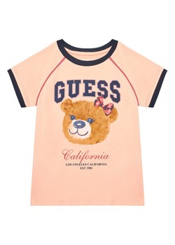 Guess T-Shirt J5YI21 K8HM4 Koralowy Regular Fit ze sklepu MODIVO w kategorii Bluzki dziewczęce - zdjęcie 184591680