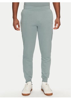 Puma Spodnie dresowe Ess 684714 Zielony Regular Fit ze sklepu MODIVO w kategorii Spodnie męskie - zdjęcie 184608170