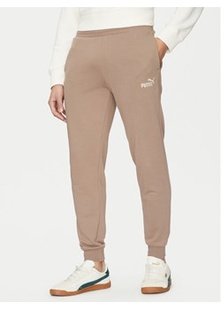 Puma Spodnie dresowe Ess No. 1 Logo 682609 Brązowy Regular Fit ze sklepu MODIVO w kategorii Spodnie męskie - zdjęcie 184608362