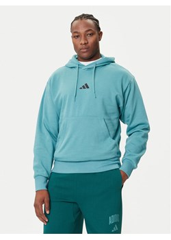 adidas Bluza Essentials Feelcozy JX5659 Turkusowy Regular Fit ze sklepu MODIVO w kategorii Bluzy męskie - zdjęcie 184661112