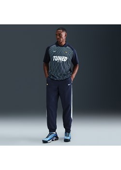 Męskie spodnie z tkaniny Nike Sportswear - Niebieski ze sklepu Nike poland w kategorii Spodnie męskie - zdjęcie 184704211