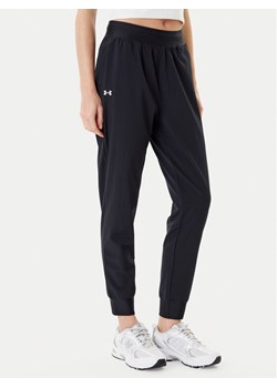 Under Armour Spodnie dresowe Armoursport High Rise Wvn Pnt 1382727-001 Czarny Loose Fit ze sklepu MODIVO w kategorii Spodnie damskie - zdjęcie 184761942