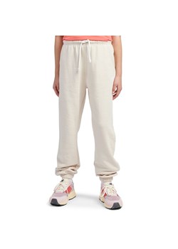 Spodnie dziecięce New Balance LAKG0058LIN - beżowe ze sklepu streetstyle24.pl w kategorii Spodnie dziewczęce - zdjęcie 184789984