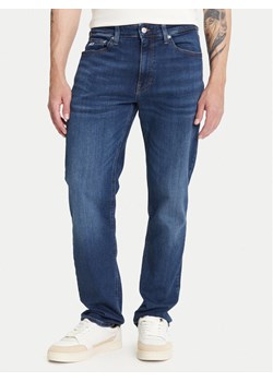 Tommy Jeans Jeansy Ryan DM0DM21892 Granatowy Slim Fit ze sklepu MODIVO w kategorii Jeansy męskie - zdjęcie 184906073