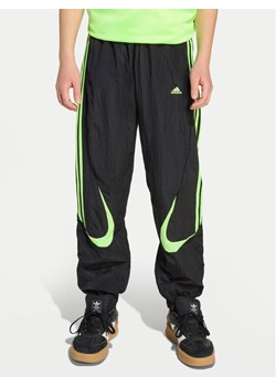 adidas Spodnie dresowe Teamgeist JY6321 Czarny Loose Fit ze sklepu MODIVO w kategorii Spodnie chłopięce - zdjęcie 184949760